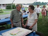  This is a photo from the 275 Angstadt reunion in Kutztown,  on the first Saturday in August 2008.  Dr. Robert Angstadt, a retired college professor, president of the Angstadt Freuschand, is shown presenting  cake to Keturah in honor of her 100th birthday.